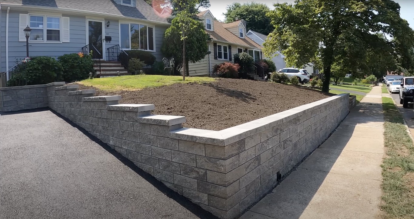 Concrete block retaining wall with professional masonry work